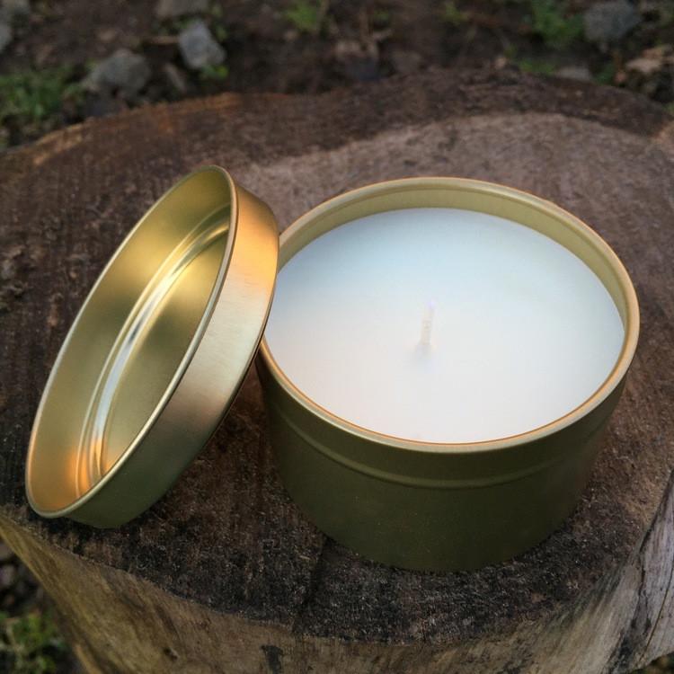 
                  
                    Load image into Gallery viewer, coffee in the rain vegan soy candle open gold tin on wooden stump in the woods
                  
                