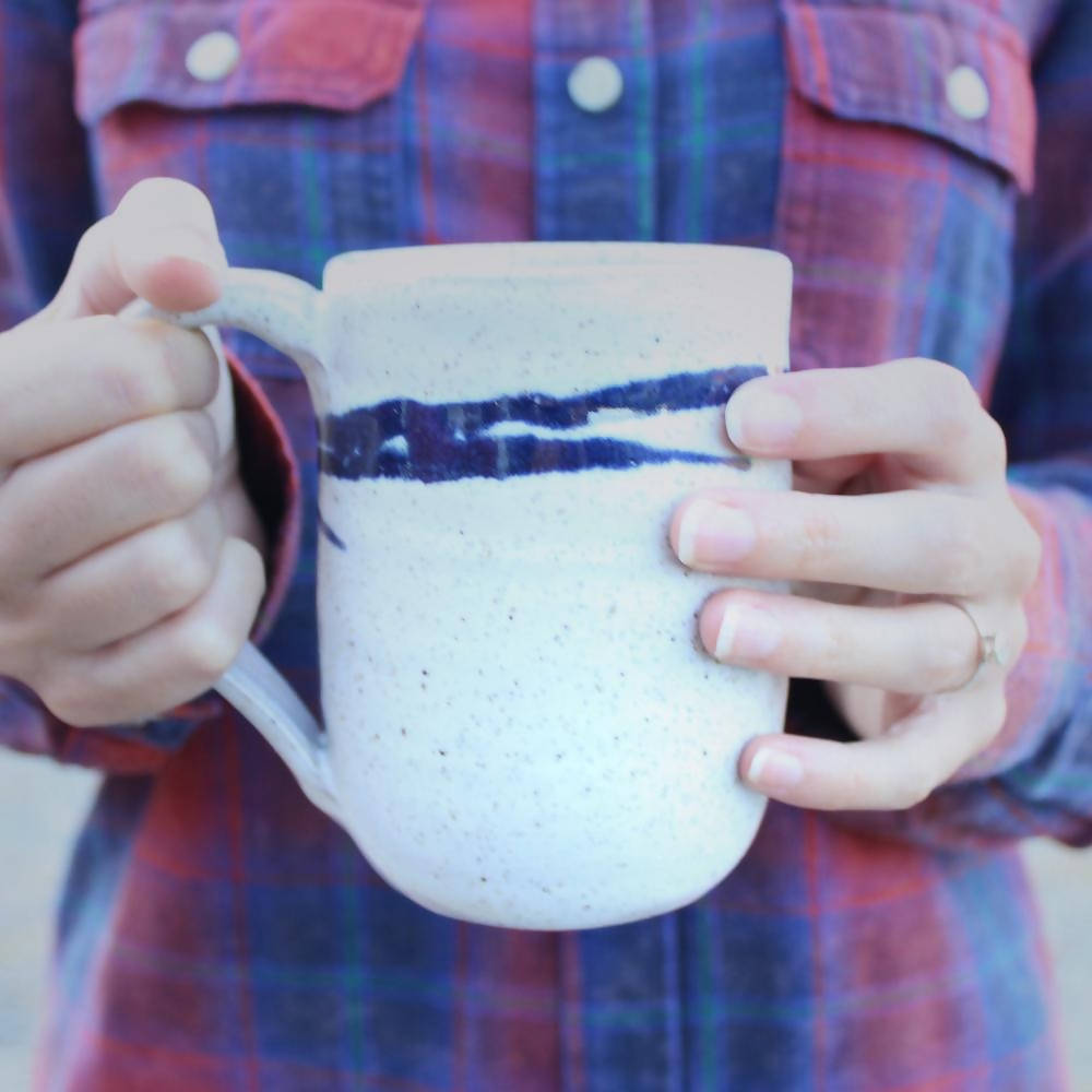 
                  
                    Load image into Gallery viewer, Mug in Speckled White with Cobalt Accents
                  
                