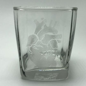 
                  
                    Load image into Gallery viewer, anatomical heart engraved soy candle in a rocks glass on white background
                  
                