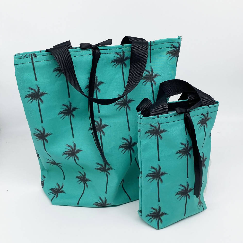 
                  
                    Load image into Gallery viewer, Palm Tree Reusable Cloth Gift Bags - Set of 5
                  
                