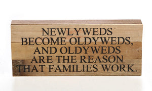 
                  
                    Load image into Gallery viewer, Newlyweds become oldyweds, and oldyweds are the reason that families work. / 14&amp;quot;x6&amp;quot; Reclaimed Wood Sign
                  
                