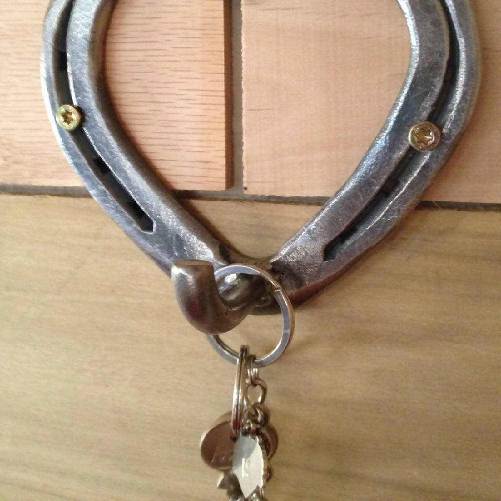 
                  
                    Load image into Gallery viewer, Hand-Forged Horseshoe Heart Hook Hanger - The Heritage Forge
                  
                